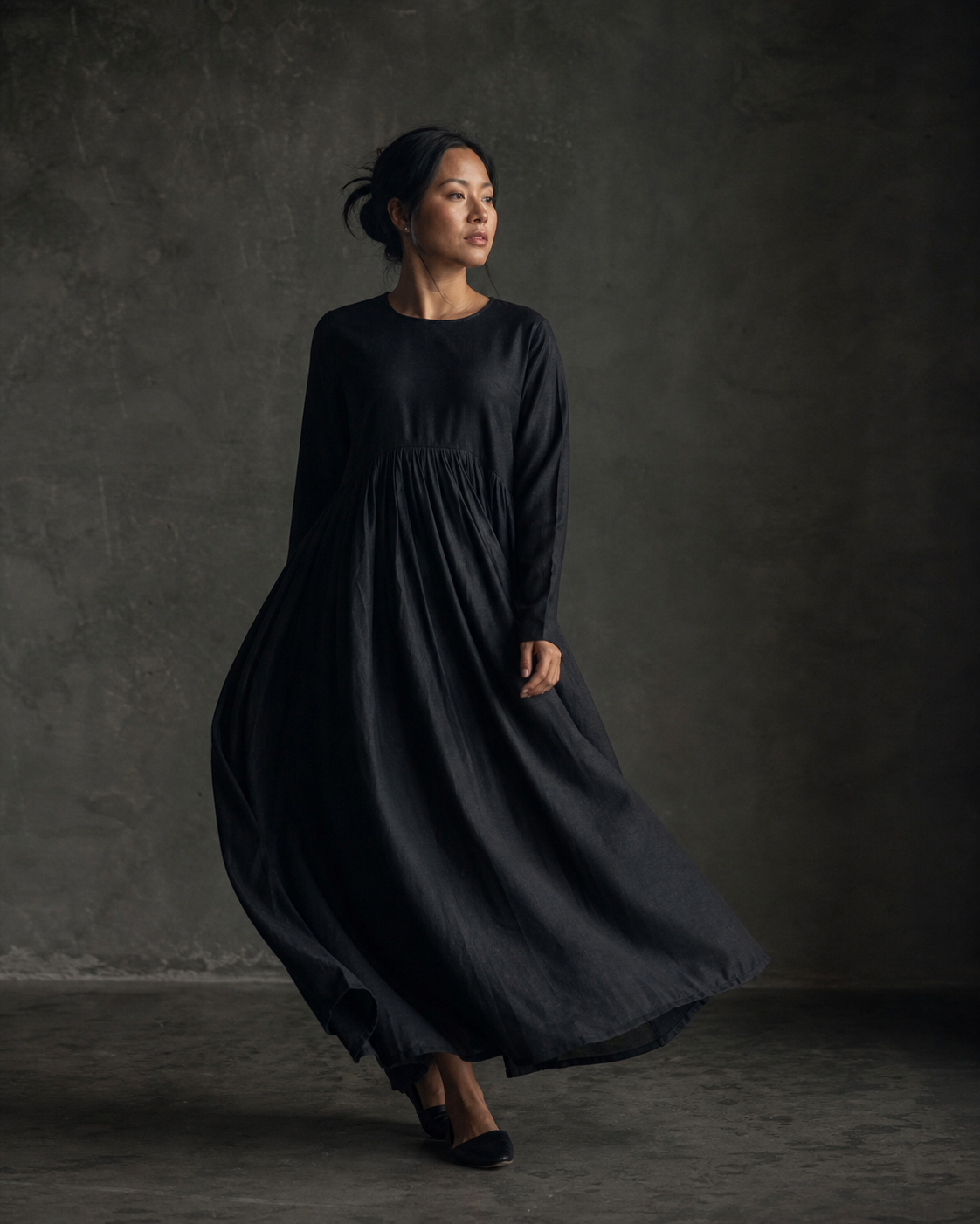 Woman wearing the flowing Raat Dress in ink-black silk cotton